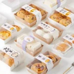 Xiamen Custom OEM Kraft Paper Chocolate Cake Box Clear Lid Embossed Design Thickened Food Grade Biodegradable Disposable Takeout