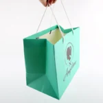 BTO Custom logo Gift Bag Glossy Clothes Branded Retail Shopping Paper Bags With Rope Handles - Imagen 3