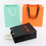 BTO Custom logo Gift Bag Glossy Clothes Branded Retail Shopping Paper Bags With Rope Handles