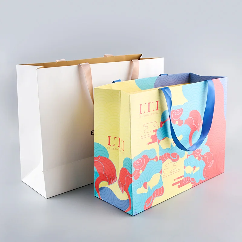 H6b4a49afa30842abbb69486f94a1b3c8P.webp Paper Bags Clothes Clothing Wedding Reusable Custom logo Low Price Shopping Kid's Gift Bucket Easter Bags With Rabbit Ears - Imagen 1