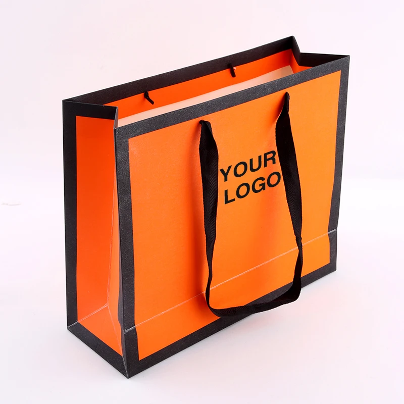 H9144639908ce43458b64226c297e03ffq.webp Thank You Custom White Orange Shopping Paper Logo Hair Gift Bag With Handle - 画像 (1)