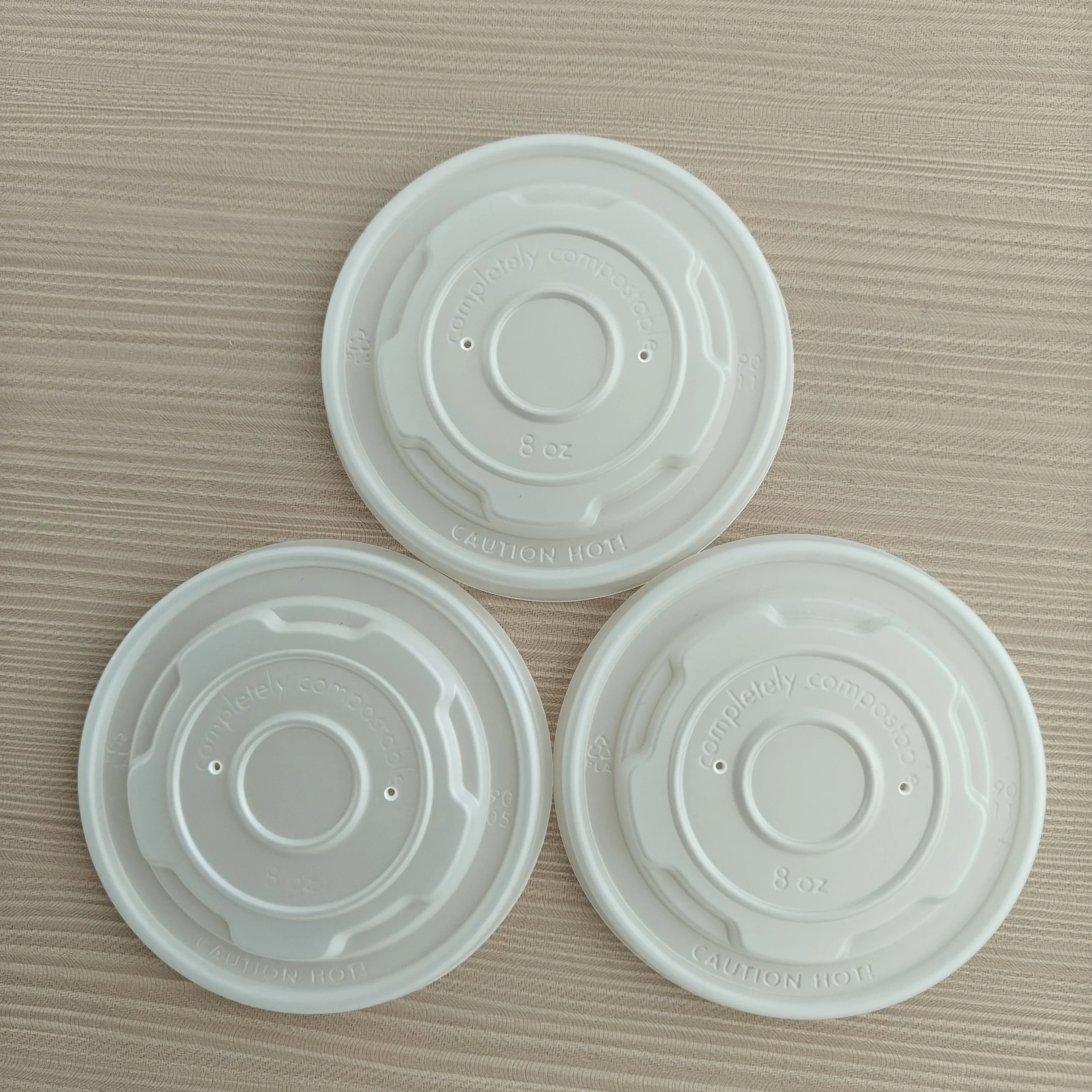 Ha10d5a0f513c445cbfe05378ad7ae4e3w.webp Xiamen 90mm Eco-Friendly Durable Pilfer-Proof PLA Plastic Lids for 8oz Paper Soup Cup Disposable Easy Open Compostable Cup Cover - 画像 (1)