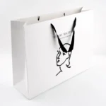 Custom Logo Cardboard Bolsas Apparel White Boutique Retail Carry Luxury Packaging Gift Paper Bag for Small Business - 画像 (3)