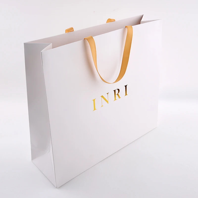 Hf5a3a3f4714f4fbc8b41edce7a22824a8.webp Custom Logo Cardboard Bolsas Apparel White Boutique Retail Carry Luxury Packaging Gift Paper Bag for Small Business - 画像 (1)